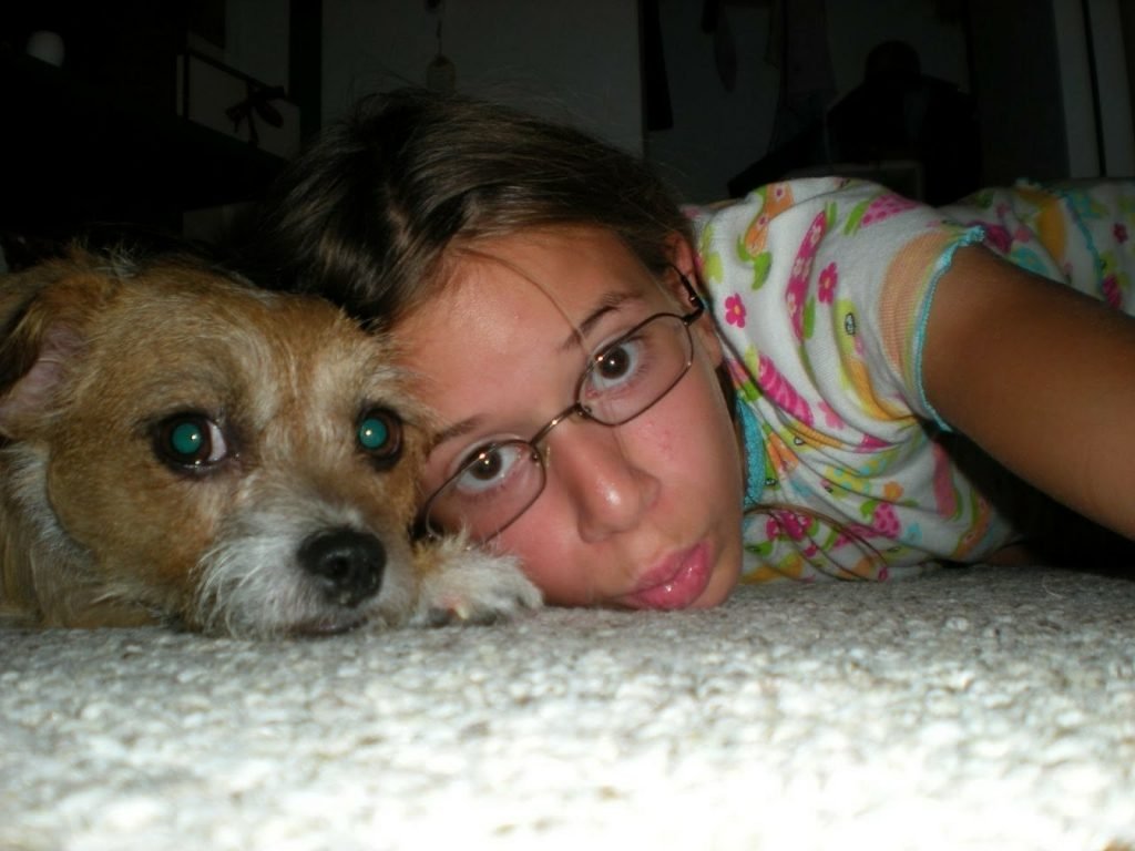 Sarah and Pippin lying on a carpet